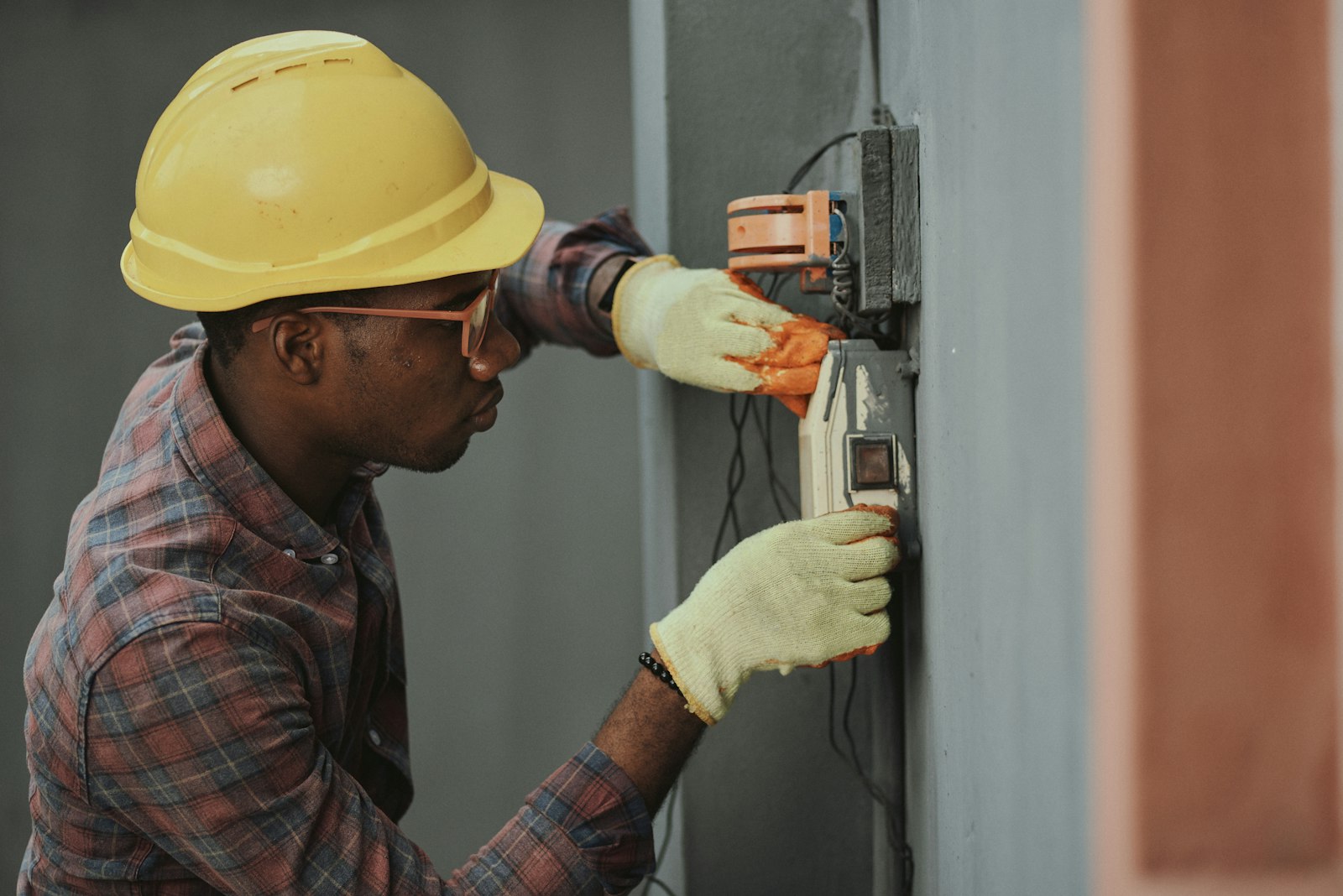 Electrician preparing wiring on a construction site